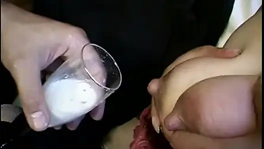 Asian girl is milking her tits in the mirror for you