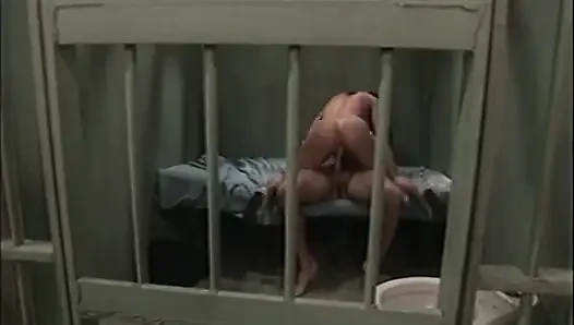 Prison guard fills up hot slut's asshole with his huge cock in a cell