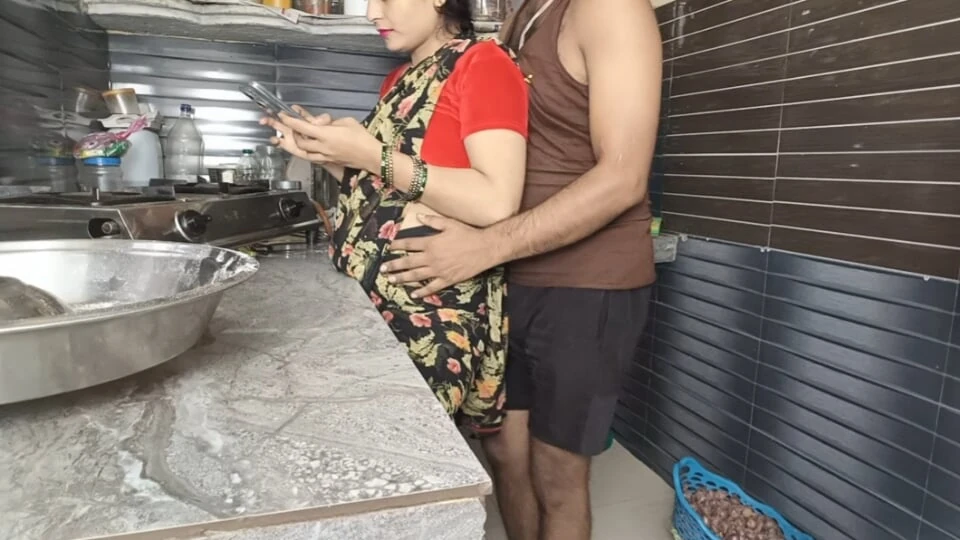 In the kitchen, the brother-in-law caught the sister-in-law from behind while using the mobile, then hard in the bedroom.