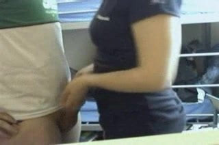 infront of a webcam in a dorm room.