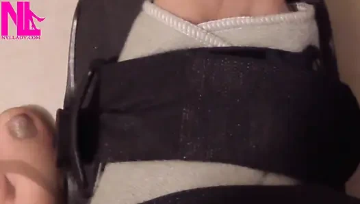 Nyllady Putting on Legcast Tutor on Her Hosed Feet