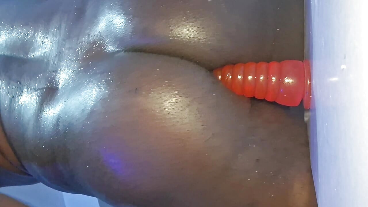 Chubby Bottom playing with dildo