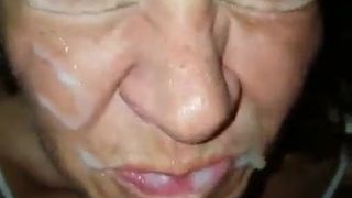 Mature slut receiving facial