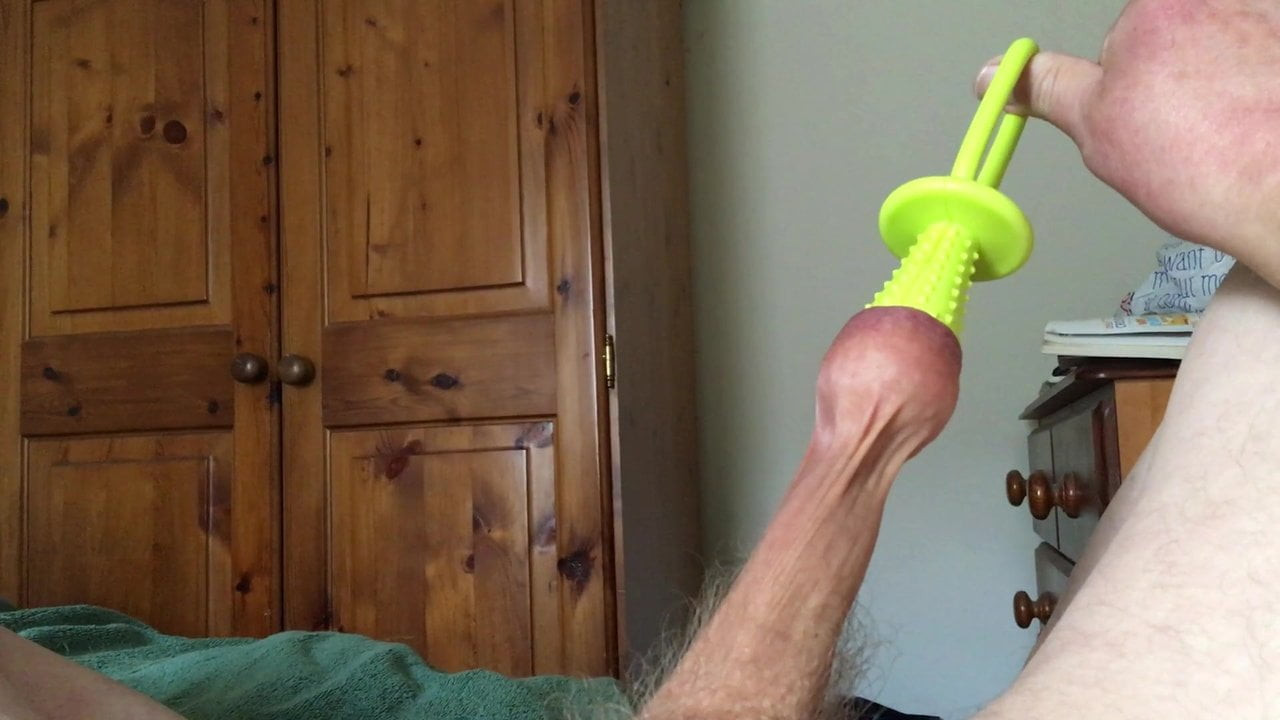 Stretch foreskin session - rubber toy