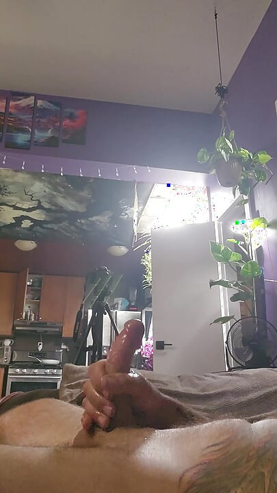 close up of big cock lubed up being stroked till it cum