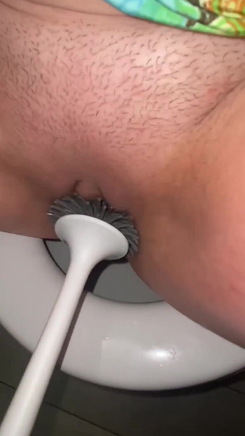 Captivating moment from "Licking public toilets in the hotel and playing with toilet brush"