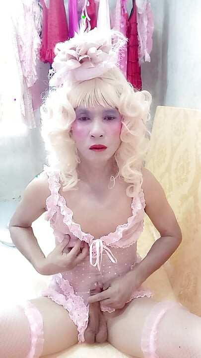 Oanh Le transgender wearing sexy porn clothes playing with a fake can