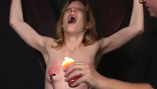 Small tits chick ends up with hot wax on her tits at the hands of her master