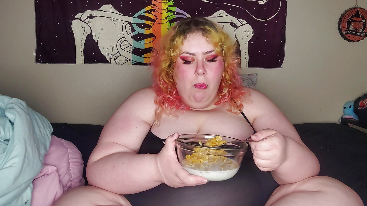 Fat woman eating frosted flakes