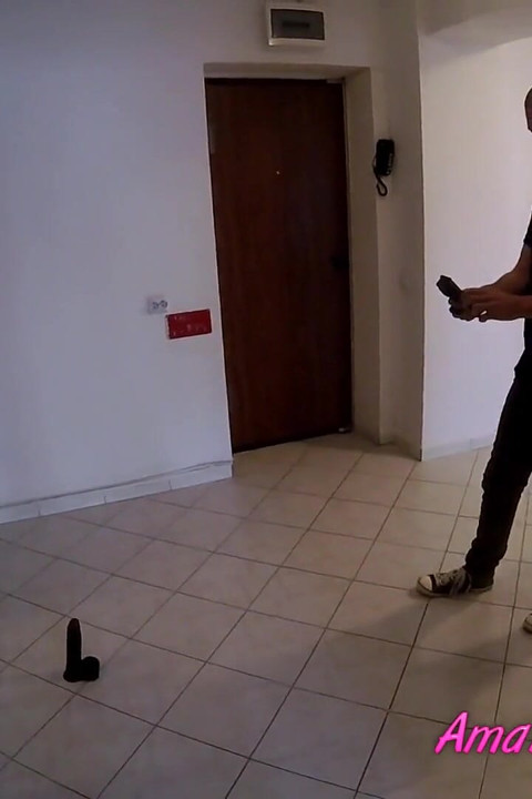 Behind the scene photographer shooting a brunette