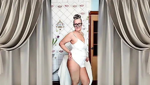 Hot mature housewife Lukerya undresses and teases with her huge tits in the kitchen