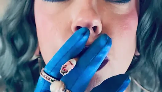 Dressed In Silver & Gloves & Rings Tina Snua Smoke A Supeking Cigarette