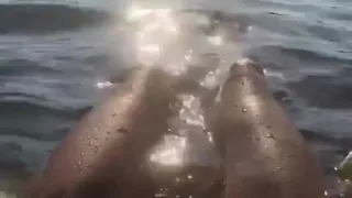 Heidi Klum floating in the water