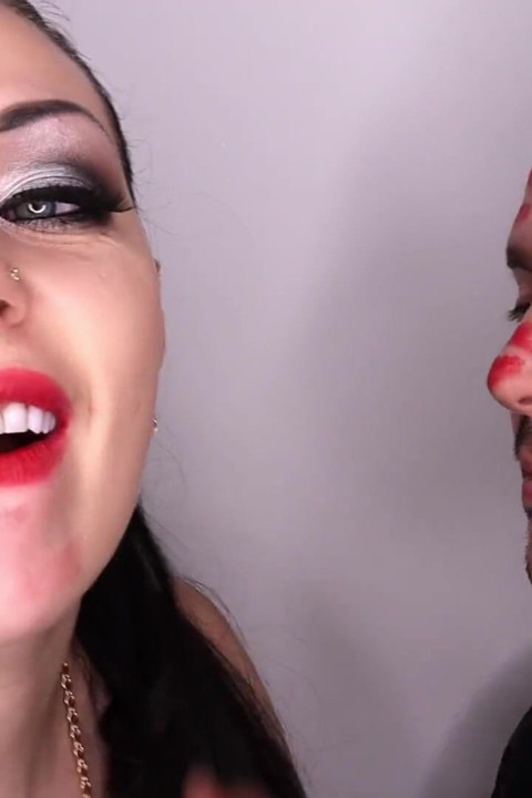 Covering Alex with strong red lipsticks kisses all over his face!