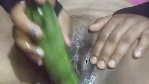 Today, Indian bhabhi quenched her desire by inserting a cucumber into her pussy.