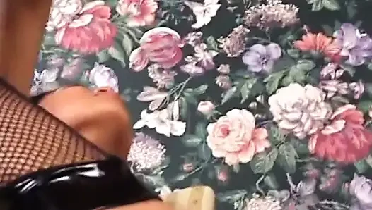 Asian beauty in fishnets fucks herself with a toy before riding white dick