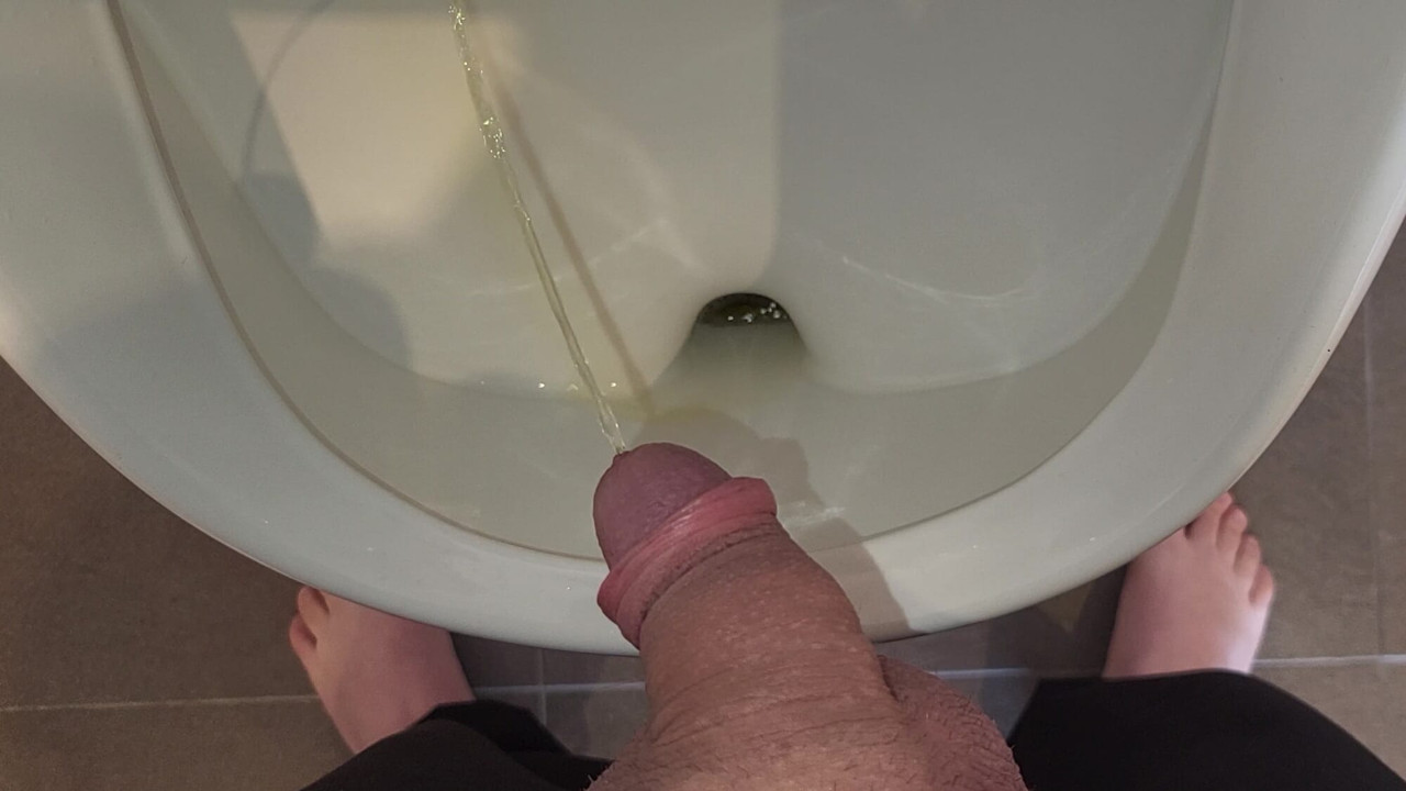 Man peeing in urinal