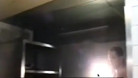 A Cook Is Cut by Her Customers in the Kitchen.