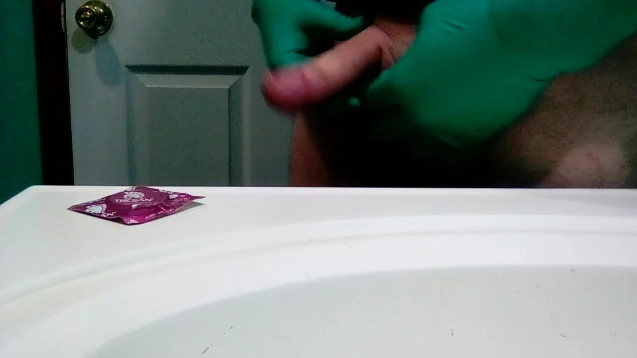 Green surgical gloves and condom