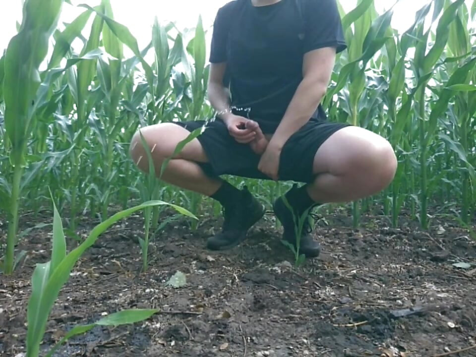Guy Pissing a Lot Near the Field in Nature