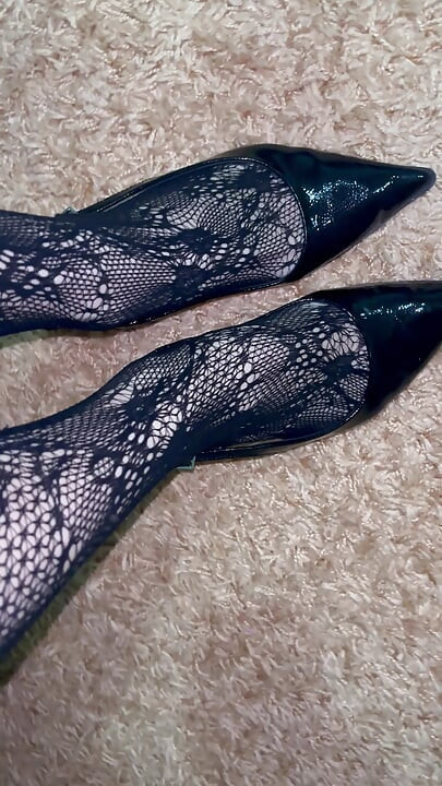 Playing with a long legs in sexy heels and stocking