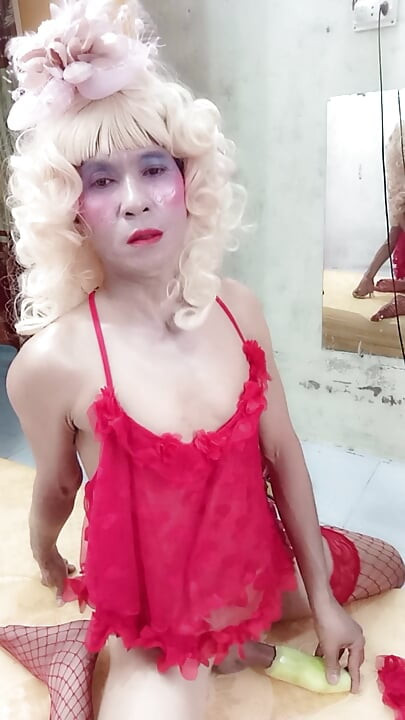 Oanh Le transgender wearing suggestive clothes to play with cans pretending to be too happy