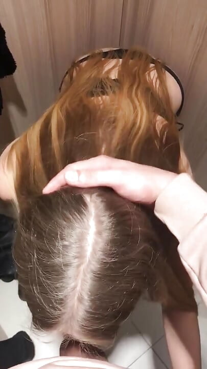 A quick blowjob and cumshot in an 18yo girl's panties in a store fitting room