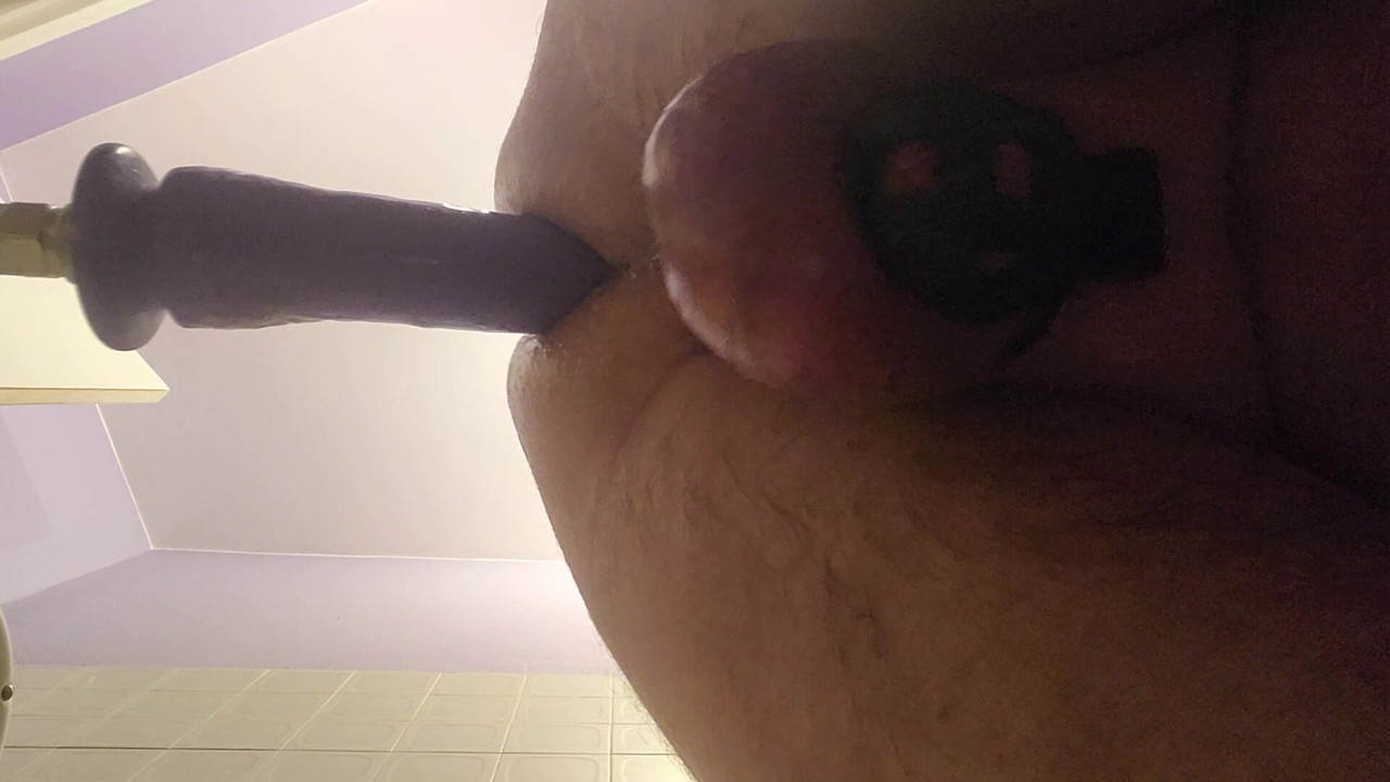 Fucking machine with chastity cage