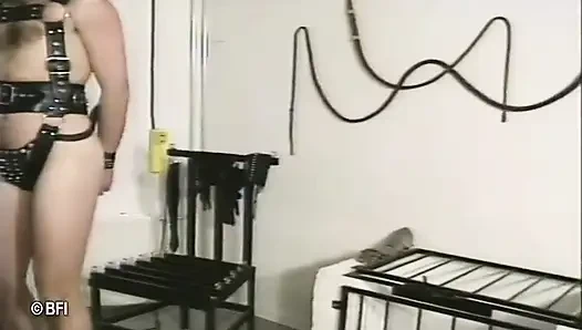 Slave tied up to a chair and whipped