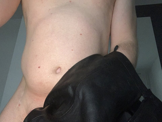 A horny leather skirt wank with a wet small cock