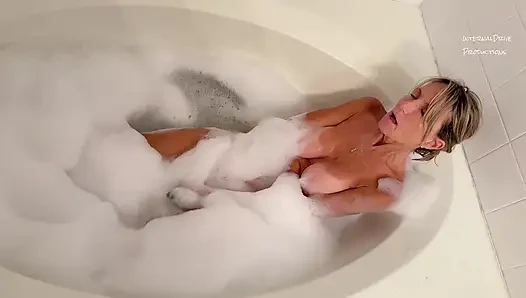 Dianne Fox in the tub with a cucumber.