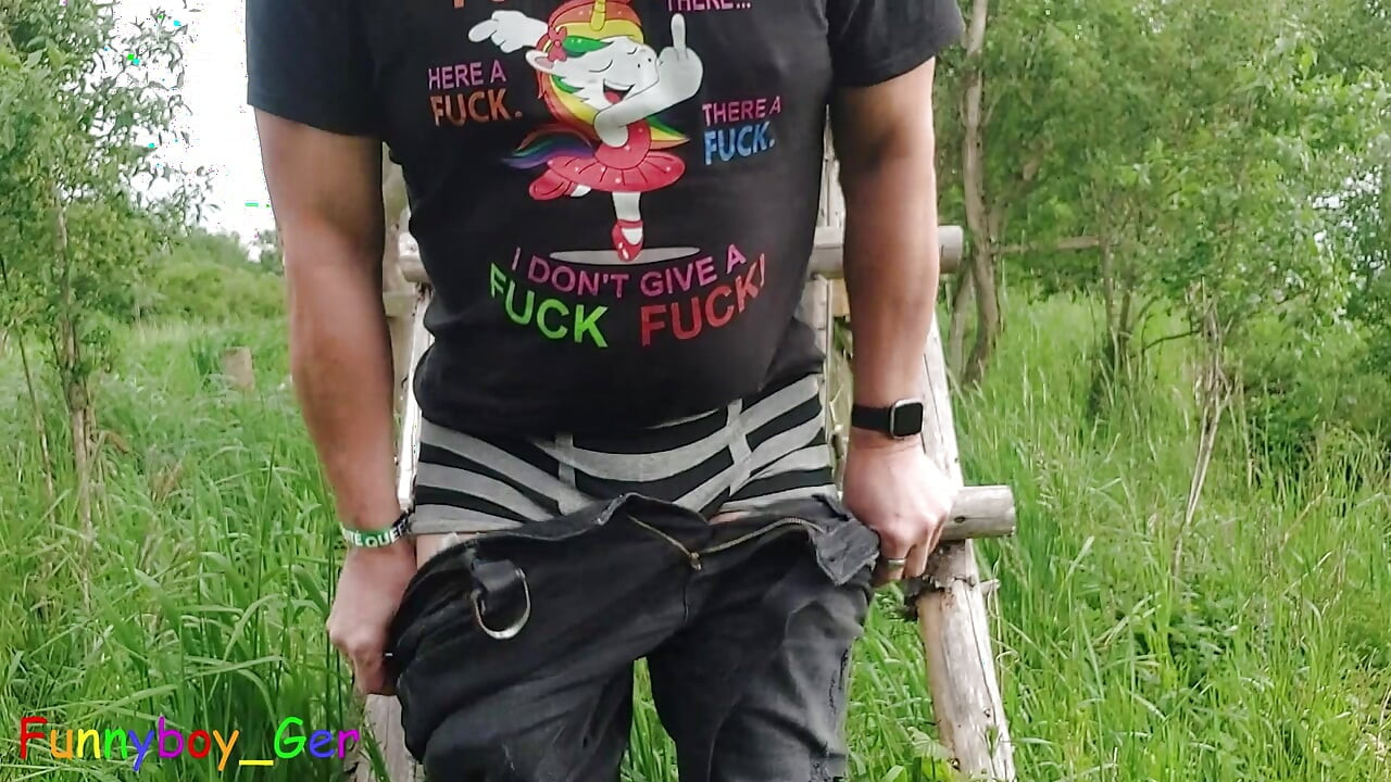 A unicorn fan jerks off his thick, shaved cock outdoor by a hunting stand.