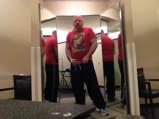 Bear jerking off in a changing room