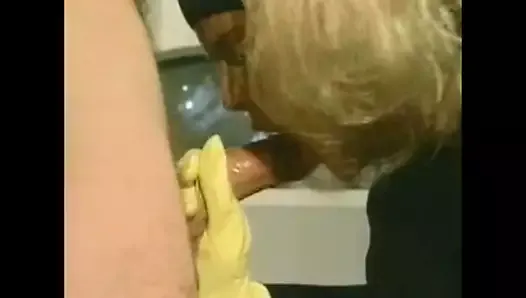 Blonde girl in kitchen latex gloves