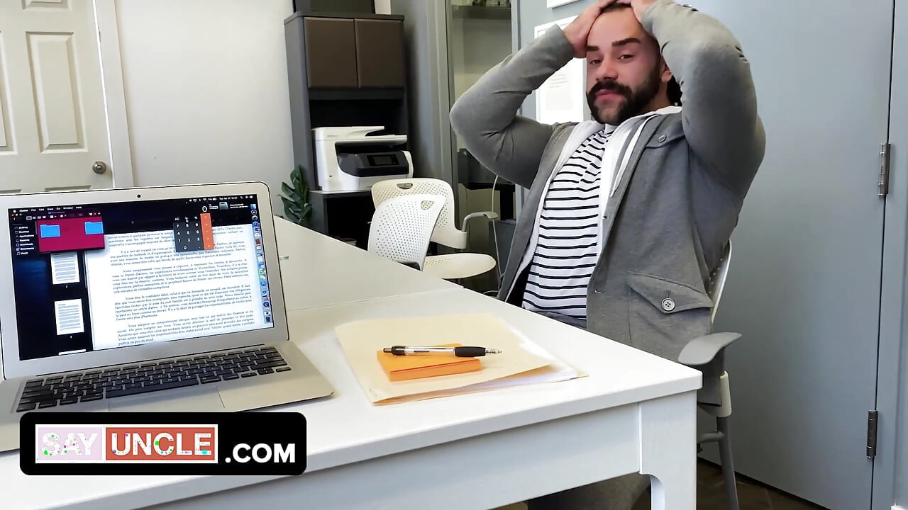 Two muscular coworkers are stuck in the office during lockdown and find a distraction from boredom