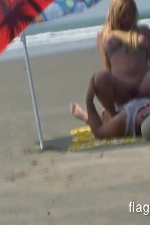 Brazilian couple having sex on the empty beach