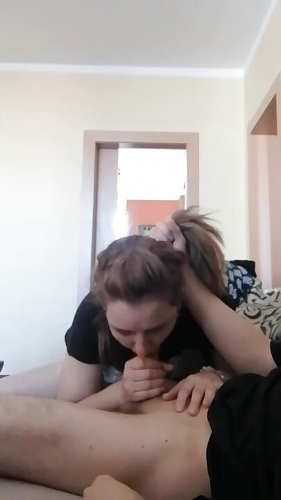 While he watches TV, I give him a blowjob
