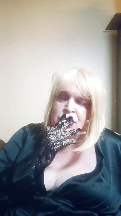 BBW TV smokes a superslim cigarette and tries on some gloves