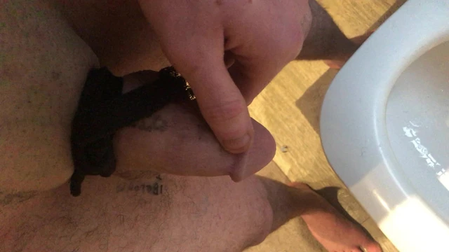 Close up pissing while my cock Is tied tight