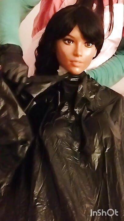 Ebony sex doll Nikki wears barberette capes