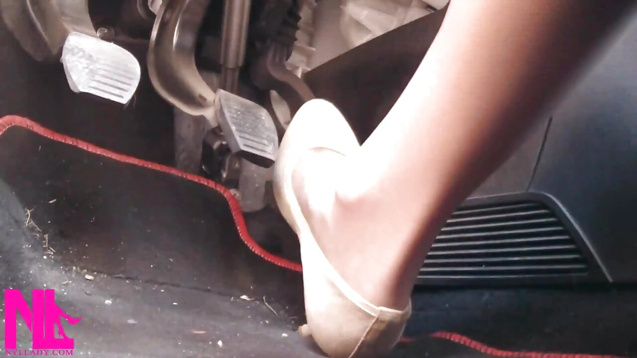Driving Fast in Beige Pumps on Way to Airport