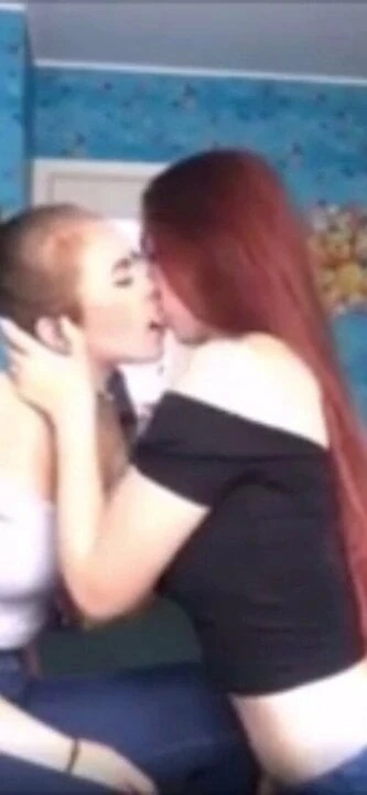 Friends kissing on camera