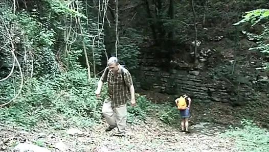 Naughty teen gets fucked by a mature guide in the woods