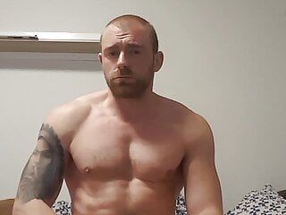muscular guy is jerking off in home