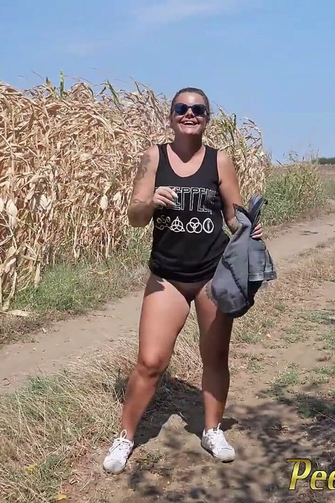 Pee standing on a dirt road in the countryside