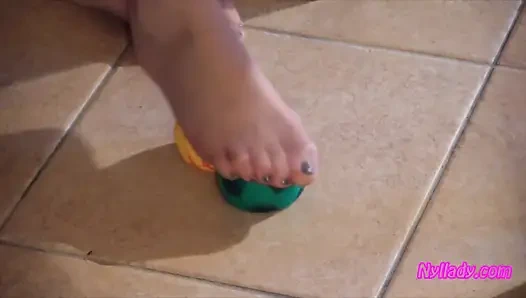 Nyllady Squeezes Rubber Balls Massaging Her Hosed Feet