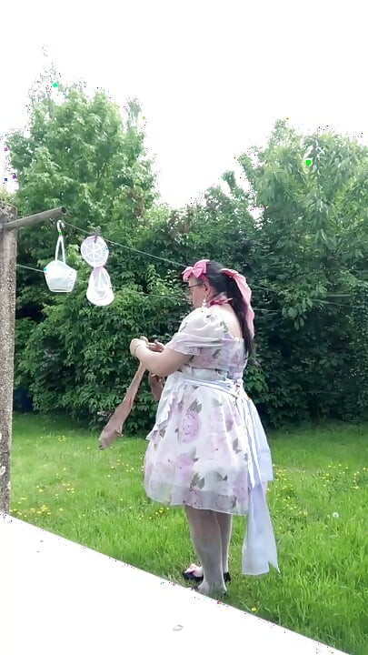 In outfit with a little babydoll dress to hang the laundry.