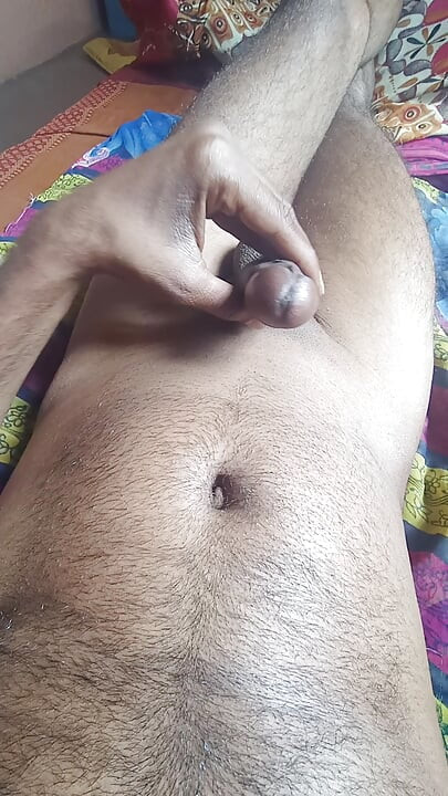 Ejaculating semen from a stiff, well-built Indian penis through masturbation