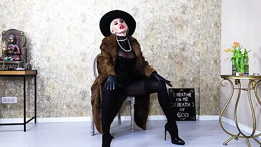 Femme fatale wearing fur coat and leather gloves