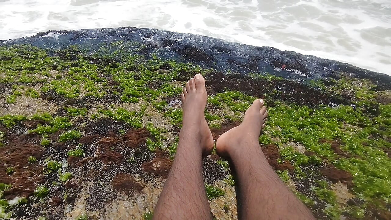 massaging my feet on the beach